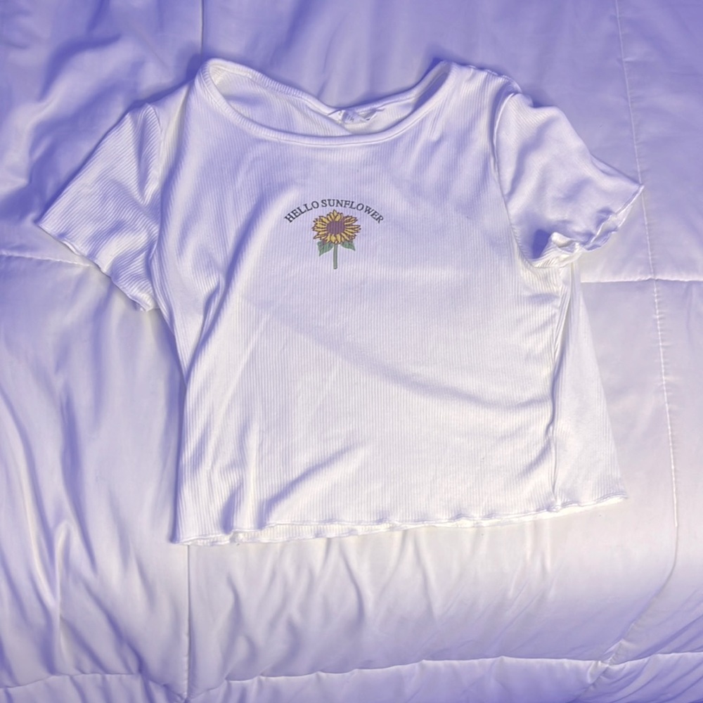 A 10 year old girl white sunflower shirt from shein.